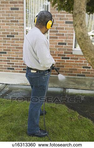 African American man using a power washer, Vancouver, BC View Large Photo Image Stock Image - African American man using a power washer, Vancouver, BC. Fotosearch