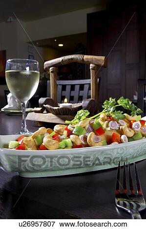 Cashew chicken dish paired with white wine View Large Photo Image Stock Photo - Cashew chicken dish paired with white wine. Fotosearch