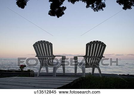 Stock Photography - Cottage chair at Lake Manitoba, Canada. Fotosearch