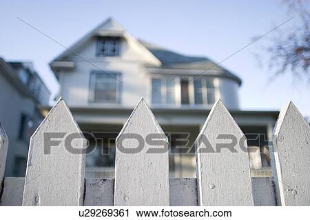 Stock Image - Fence in front of a house, Manitoba, Canada. Fotosearch