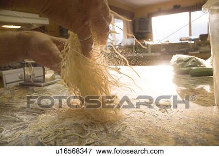 Stock Photo - Making pasta at home, Okanagan Centre, BC Canada. Fotosearch