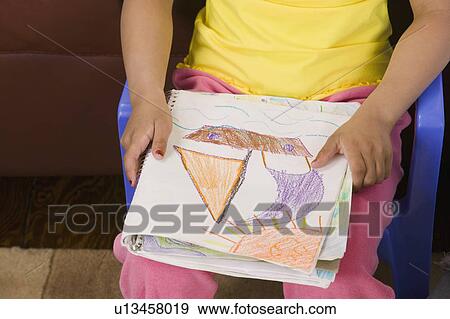 Mulatto girl 6 years old with her artwork. View Large Photo Image Stock Photo - Mulatto girl 6 years old with her artwork.. Fotosearch