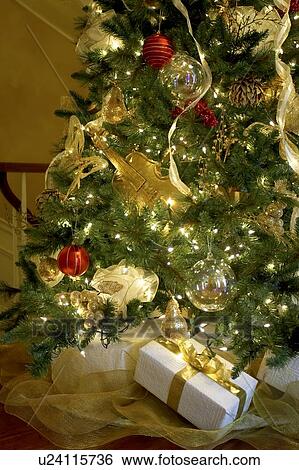 Stock Photograph - Presents under a Christmas tree, Canada, Ontario. Fotosearch