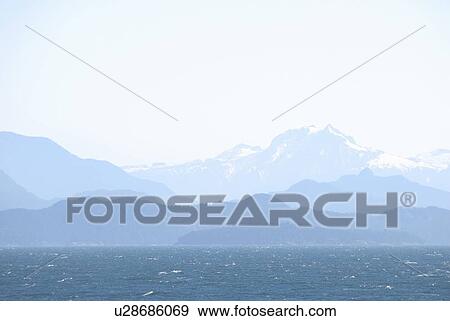 BC's Coast mountains as seen from a BC Ferry in the Strait of Georgia View Large Photo Image Stock Photo - BC's Coast mountains as seen from a BC Ferry in the Strait of Georgia. Fotosearch