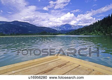 Stock Image - One Mile Lake, near Pemberton, BC with dock in foreground. Fotosearch