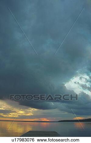 Rain clouds over Clear Lake; Canada, Manitoba, Riding Mountain National Park View Large Photo Image Stock Photograph - Rain clouds over Clear Lake; Canada, Manitoba, Riding Mountain National Park. Fotosearch