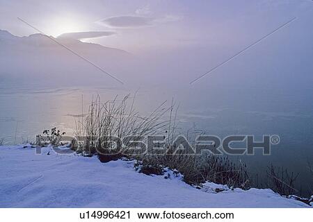 Early morning sun rises over Whistler mountain and Green Lake, B. C. View Large Photo Image Stock Image - Early morning sun rises over Whistler mountain and Green Lake, B. C.. Fotosearch