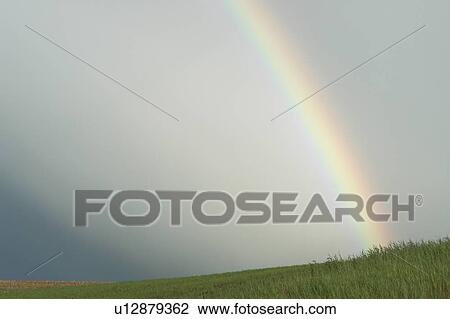 Stock Image - Rainbow, rural Manitoba, Canada. Fotosearch