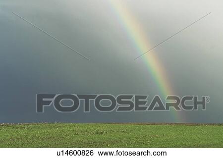 Stock Photograph - Rainbow, rural Manitoba, Canada. Fotosearch
