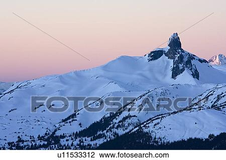 Stock Image - Sunrise on Black Tusk; Whistler, BC.. Fotosearch