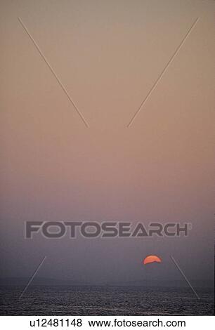 Sunset is red over mountains of Vancouver Island, from water View Large Photo Image Stock Photo - Sunset is red over mountains of Vancouver Island, from water. Fotosearch