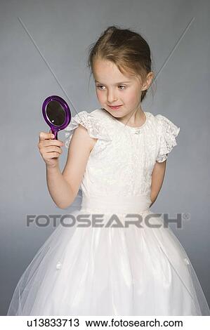 5 year old girl in white dress looking in mirror View Large Photo Image Stock Image - 5 year old girl in white dress looking in mirror. Fotosearch