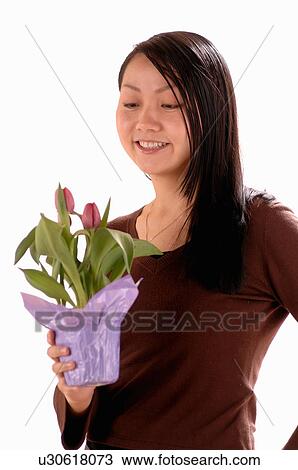 Asian Young girl w/Flower, Regina, Saskatchewan View Large Photo Image Stock Image - Asian Young girl w/Flower, Regina, Saskatchewan. Fotosearch