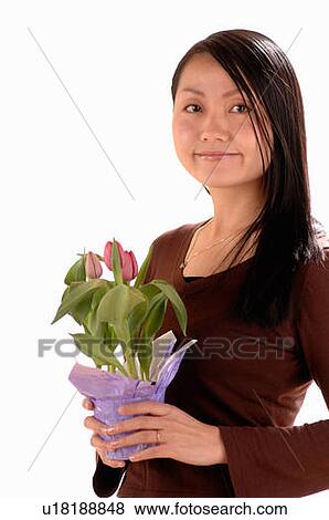 Asian Young girl w/Flower, Regina, Saskatchewan View Large Photo Image Stock Photo - Asian Young girl w/Flower, Regina, Saskatchewan. Fotosearch