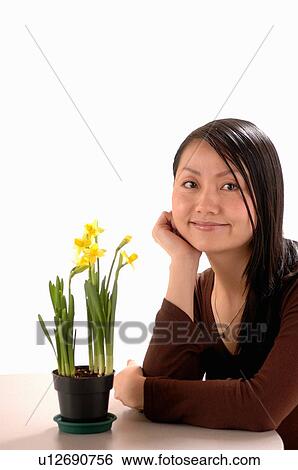 Asian Young girl w/Flower, Regina, Saskatchewan View Large Photo Image Stock Photograph - Asian Young girl w/Flower, Regina, Saskatchewan. Fotosearch