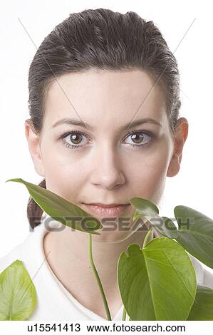 face of a young woman with leaves View Large Photo Image Stock Image - face of a young woman with leaves. Fotosearch