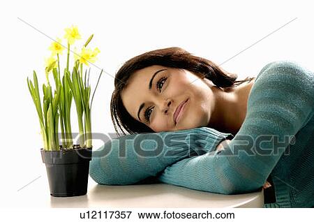 Stock Photo - Young girl w/Flower, Regina, Saskatchewan. Fotosearch