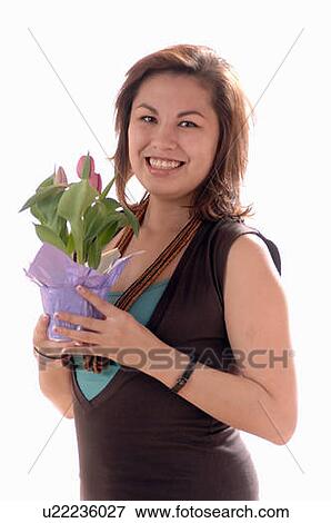 Stock Photo - Young girl w/Flower, Regina, Saskatchewan. Fotosearch