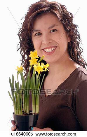 Stock Photography - Young girl w/Flower, Regina, Saskatchewan. Fotosearch