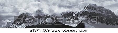 Stock Photo - Cloudy Ridge near Waterton Lakes National Park, Alberta, Canada. Fotosearch