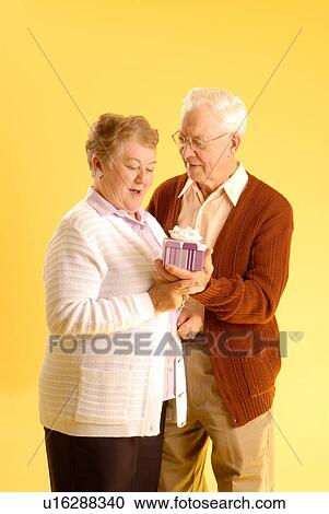 Stock Image - Senior couple posing; Canada, Saskatchewan, Regina. Fotosearch