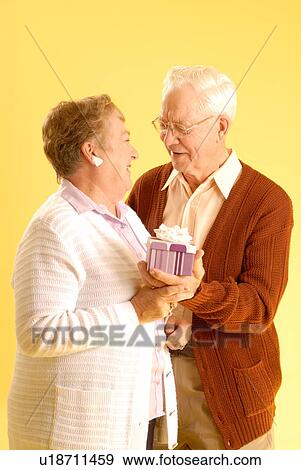 Stock Photo - Senior couple posing; Canada, Saskatchewan, Regina. Fotosearch