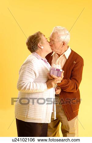 Senior couple posing; Canada, Saskatchewan, Regina View Large Photo Image Stock Photograph - Senior couple posing; Canada, Saskatchewan, Regina. Fotosearch
