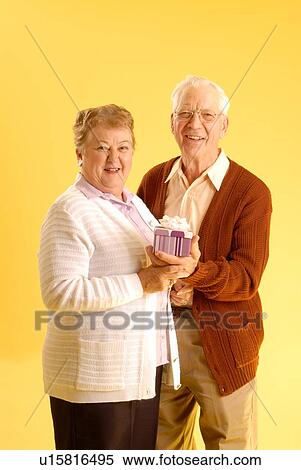 Stock Photography - Senior couple posing; Canada, Saskatchewan, Regina. Fotosearch