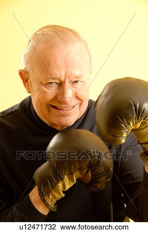 Senior male boxing gloves; Canada, Saskatchewan, Regina View Large Photo Image Stock Image - Senior male boxing gloves; Canada, Saskatchewan, Regina. Fotosearch