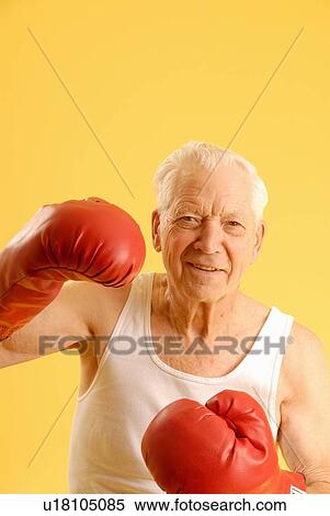 Stock Photography - Senior male boxing gloves, Regina, Saskatchewan. Fotosearch