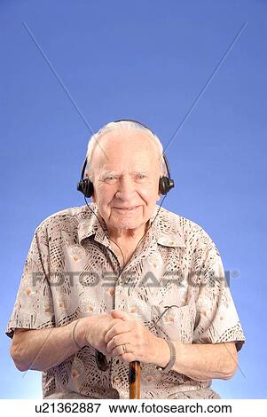 Senior Male Headphones; Canada, Saskatchewan, Regina View Large Photo Image Stock Photo - Senior Male Headphones; Canada, Saskatchewan, Regina. Fotosearch