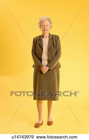 Stock Photo - Senior Woman Standing, Regina, Saskatchewan. Fotosearch