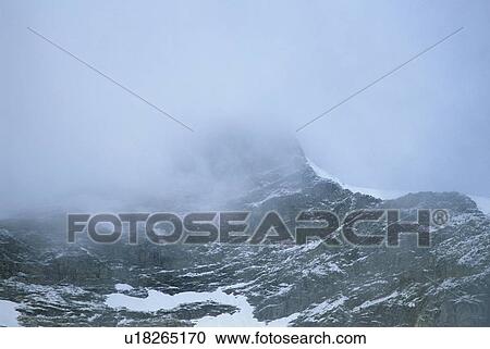 Mountain ridge with cloud cover and snow patched, Athabasca Pass, Jasper National Park View Large Photo Image Stock Image - Mountain ridge with cloud cover and snow patched, Athabasca Pass, Jasper National Park. Fotosearch
