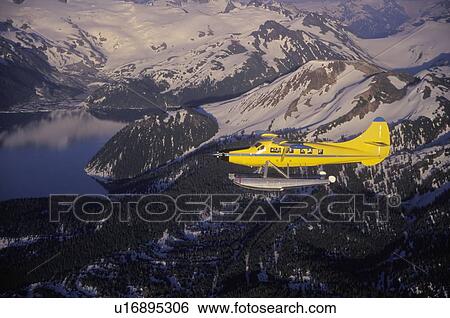 Whistler Air flying over the Coast Mountains near Whistler, British Columbia. View Large Photo Image Stock Photograph - Whistler Air flying over the Coast Mountains near Whistler, British Columbia. . Fotosearch