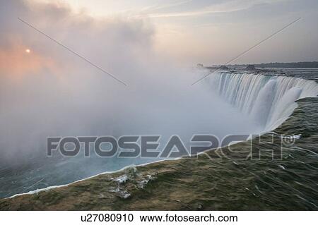 Stock Image - Sunrise and Horseshoe Falls - Niagara Falls Ontario Canada. Fotosearch