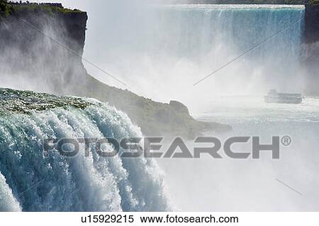 The American Falls from Prospect Point (Niagara Falls State Park - Niagara Falls New York USA) with Horseshoe Falls and the 'Maid of the Mist' in the background, USA, New York View Large Photo Image Stock Photography - The American Falls from Prospect Point (Niagara Falls State Park - Niagara Falls New York USA) with Horseshoe Falls and the 'Maid of the Mist' in the background, USA, New York. Fotosearch