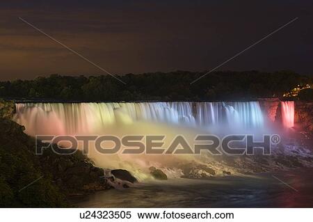 The American Falls lit up at night looking towards Niagara Falls State Park - Niagara Falls New York USA View Large Photo Image Stock Photography - The American Falls lit up at night looking towards Niagara Falls State Park - Niagara Falls New York USA. Fotosearch