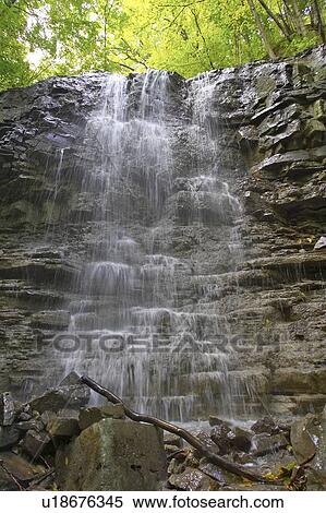 Stock Photography - Waterfall over rocky ledge, Canada, Ontario, Hamilton. Fotosearch