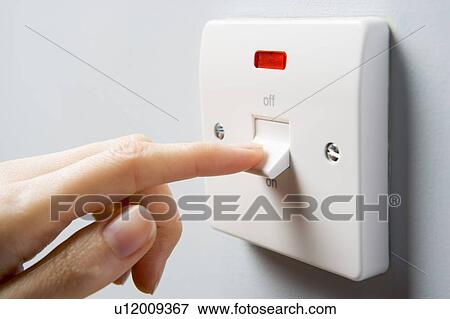 Stock Photo - Close Up Of Switch Being Activated. Fotosearch