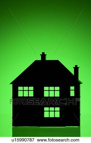 Stock Photo - House Shape Against Green Background. Fotosearch