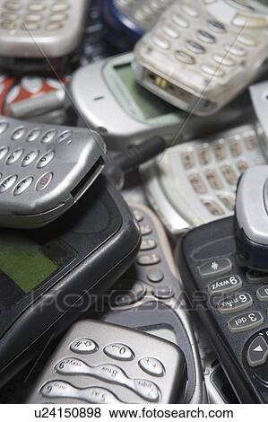 Stock Photo - Pile Of Used Mobile Phones. Fotosearch