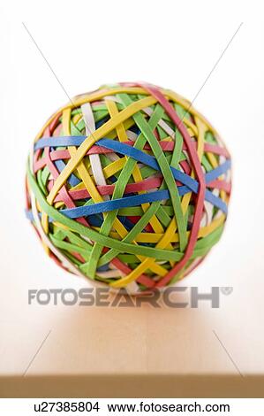 Picture - Rubber Band Ball Sitting On Desk. Fotosearch