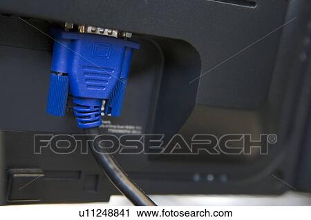 Stock Image - Shot of a cable plugged into a computer monitor. Fotosearch