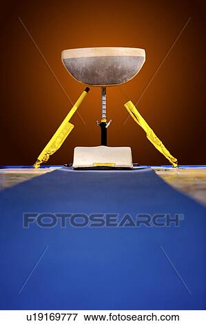 Stock Photo - Vaulting horse in the gymnasium. Fotosearch
