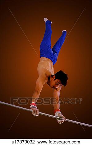 Young man practicing gymnastics on the horizontal bar View Large Photo Image Stock Image - Young man practicing gymnastics on the horizontal bar. Fotosearch