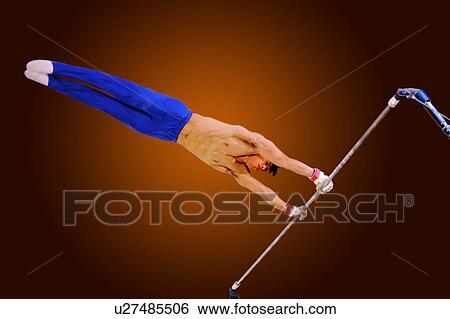 Young man practicing gymnastics on the horizontal bar View Large Photo Image Stock Photograph - Young man practicing gymnastics on the horizontal bar. Fotosearch