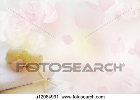 A heart-shaped soap and a starfish on folded towels with flowers (composite) View Large Illustration Clip Art - A heart-shaped soap and a starfish on folded towels with flowers (composite). Fotosearch