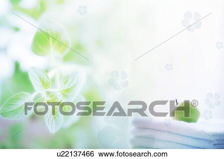 An apple on towels & flowers (composite) View Large Illustration Stock Illustration - An apple on towels & flowers (composite). Fotosearch