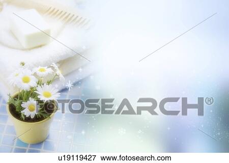 Soap, comb on the folded towel behind a potted plant (composite) View Large Illustration Stock Illustration - Soap, comb on the folded towel behind a potted plant (composite). Fotosearch