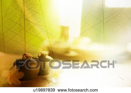 SPA treatment on the table and a transparent leaf vein (composite) View Large Illustration Stock Illustration - SPA treatment on the table and a transparent leaf vein (composite). Fotosearch